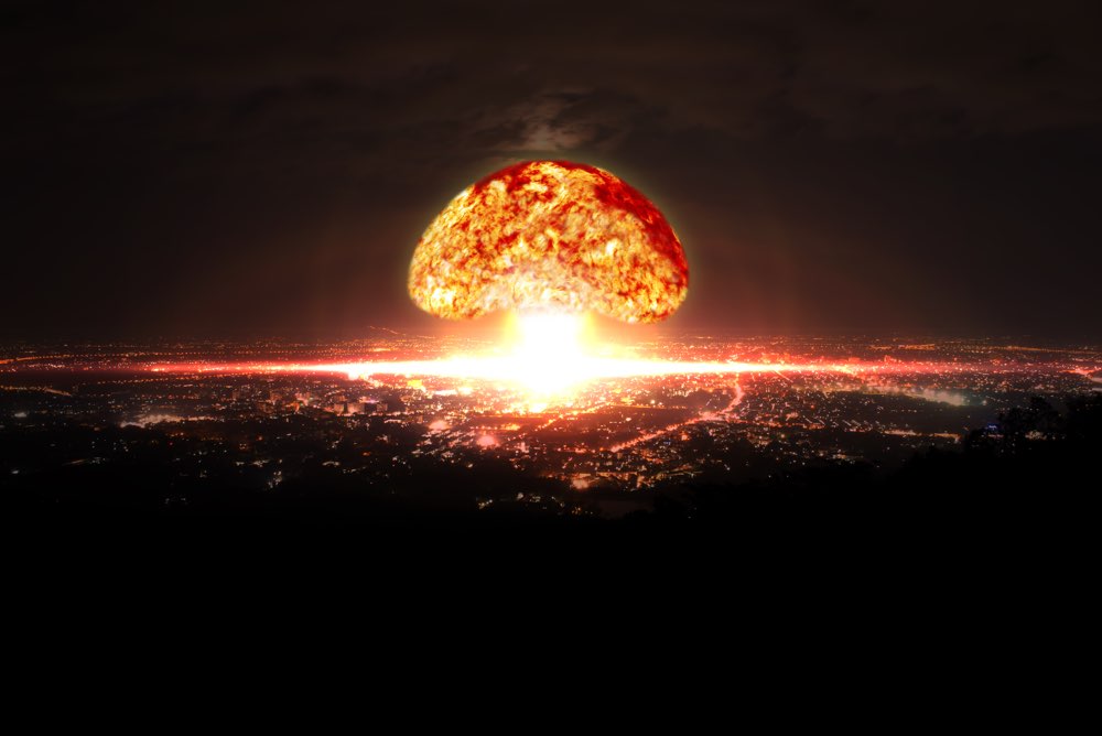 Explosion of nuclear bomb over city. Explosion of nuclear bomb.