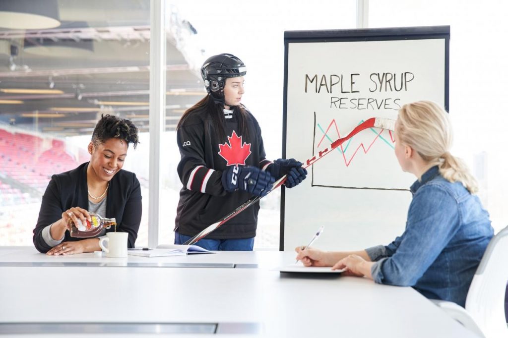 Colleague enjoys tasty glass of maple syrup